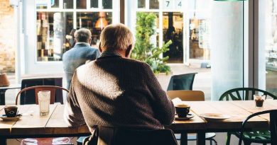 man alone in a café